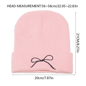 Pink knit beanie with bow embroidery and detailed 20x21cm size measurements