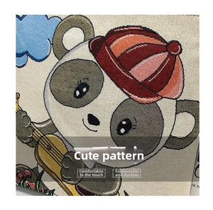 Close-up of embroidered panda playing lute on a textured linen tote bag detail