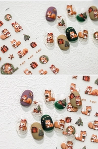 Detail of Christmas nail stickers with cartoon squirrel, trees and gift box patterns