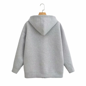 Back view of a grey long-sleeved hoodie with ribbed cuffs and a textured knit finish