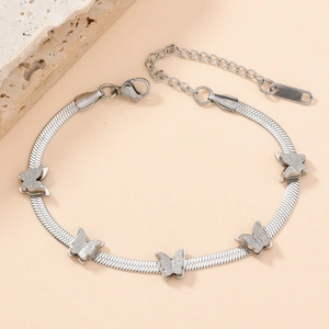 Detail of silver butterfly bracelet with frosted texture charms and snake chain clasp