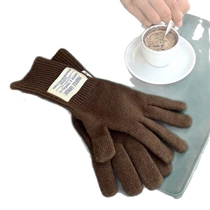 Brown wool knit long gloves for women in a cozy winter lifestyle setting