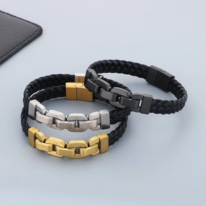 Detail showing braided leather bracelets with matte black, silver, and gold chain links
