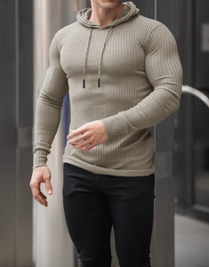 Close-up of olive green slim fit hooded gym sweatshirt showing elastic ribbed texture
