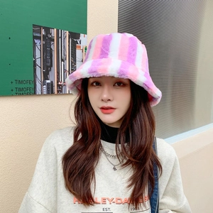 Detail shot of colorful striped plush bucket hat with pink orange and white faux fur texture