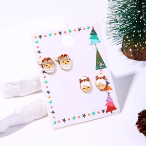 Festive Christmas stud earrings set featuring Santa Claus and girl motifs with crystals