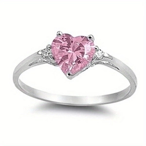 Women's heart-shaped ring featuring a pink heart-cut gemstone set in polished silver metal