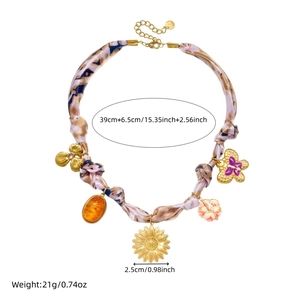 Retro gold-plated sunflower and butterfly charms on a leopard print fabric necklace