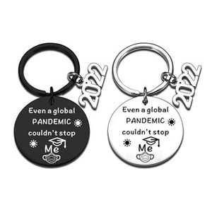 Detail of black and silver Drive Safe keychains with pandemic text and 2022 charms