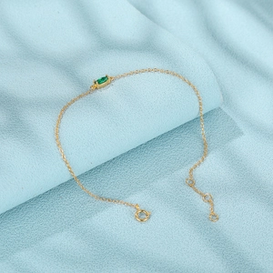 Detail of a gold S925 silver bracelet featuring a marquise-cut green zircon and spring clasp
