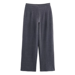 Close-up of high-waisted dark grey wide-leg trousers with front pleats and twill texture