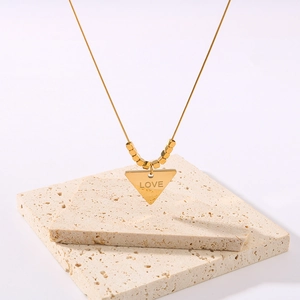Minimalist 18K gold stainless steel necklace with triangle pendant and beads on stone