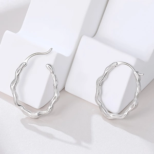 Minimalist S925 sterling silver hoop earrings featuring irregular wave texture design