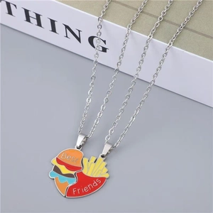 Detail of Best Friends necklace set featuring rainbow burger and fries heart pendants