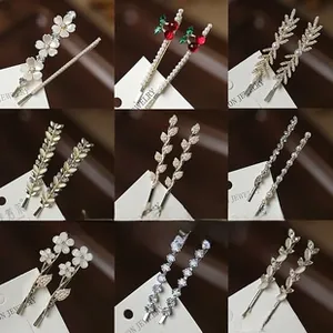 Detail of Korean style rhinestone hair clips featuring floral, cherry and pearl designs