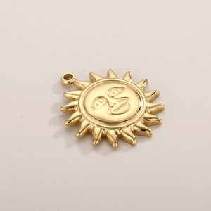 Minimalist golden sun face pendant in stainless steel with detailed facial engraving