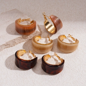 Three pairs of vintage resin C-shaped hoop earrings in amber and tortoiseshell finish