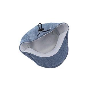 Blue washed denim Boston flat cap for babies featuring an adjustable inner drawstring
