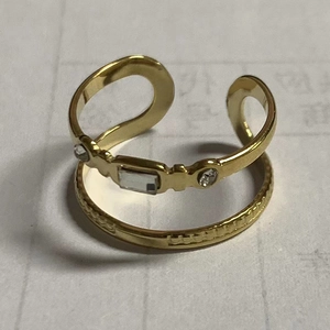 Golden stackable ring set with rectangle clear crystals and textured band detail