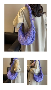 Detailed views of purple quilted dumpling bag with pleated texture and large hobo capacity