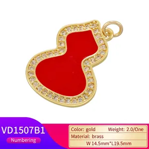 Golden gourd pendant with red enamel inlay and zircon borders on white background