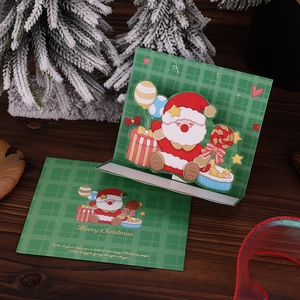 Detailed view of a 3D pop-up Christmas card featuring Santa Claus and gold stamping