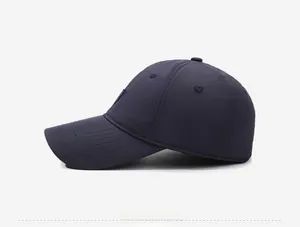 Side view of navy blue winter baseball cap with waterproof fabric and reinforced stitching