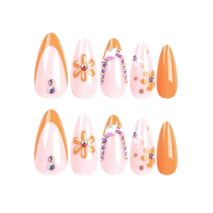 Faux ongles amande courts avec French manucure orange, motifs floraux et strass colorés