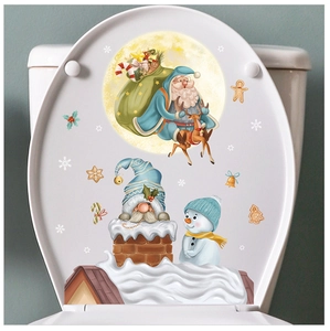 Detail of Christmas Santa Claus and reindeer stickers on a white toilet seat cover