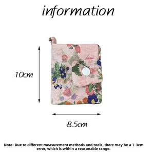 Detail showing pink floral quilted cotton coin purse with white snap button closure and dimensions