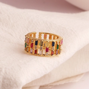 Close-up of gold open ring featuring vibrant multi-colored rectangular zircon stones