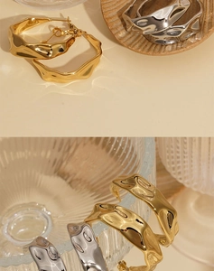 Detailed view of C-shaped 316 stainless steel earrings with irregular hammered texture