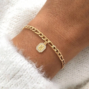 Gold plated Cuban chain bracelet featuring a zircon-encrusted octagon M letter charm