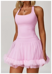 Detailed close-up of pink brushed racerback sports tank with layered mesh tutu skirt