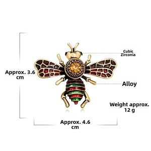 Detail view of bee brooch with enamel wings, yellow rhinestone, and dimensions markings