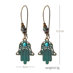 Vintage bronze Hamsa earrings with turquoise beads showing 6.5cm length and dimensions