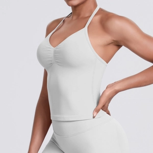Detail showing the thin shoulder straps and delicate pleated neckline of the sports tank top