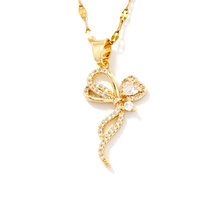 Elegant gold butterfly necklace with shimmering zircons on a delicate water wave chain