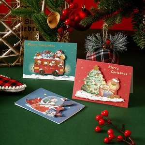 3D pop-up Christmas greeting cards featuring tree, bus and snow globe designs