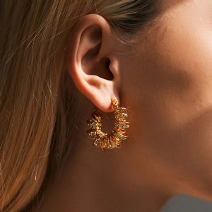 Gold plated spiral hoop earrings with pavé zircons in a textured woven design