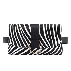 Fashion zebra print belt bag with decorative gold metal ring on a clean white background