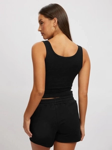 Rear view of black ribbed knit tank top and shorts set on a light grey background