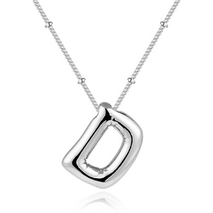 Macro shot of silver letter D balloon pendant on a delicate bead chain necklace