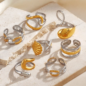 Minimalist 7-piece gold and silver mixed metal ring set with starfish and shell designs