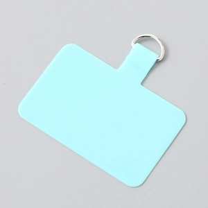 Close-up of mint green silicone phone tether tab with silver stainless steel D-ring