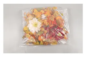 Detail of autumn decoration kit with maple leaves and pumpkins in OPP packaging