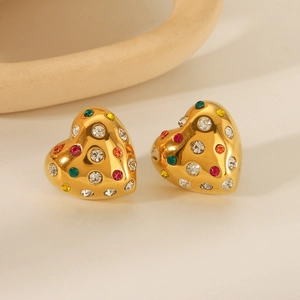 Polished 18K gold heart earrings with colorful rhinestones on a minimalist background