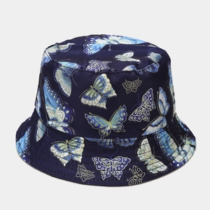 Close-up of dark blue bucket hat with golden butterfly embroidery and satin finish