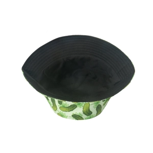 Detail of white cotton bucket hat featuring green pickle print and black inner lining