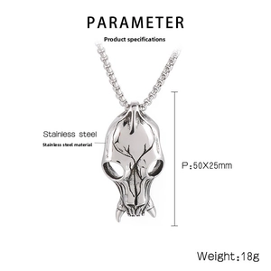 Macro detail of retro punk skull pendant in polished stainless steel with dark textures